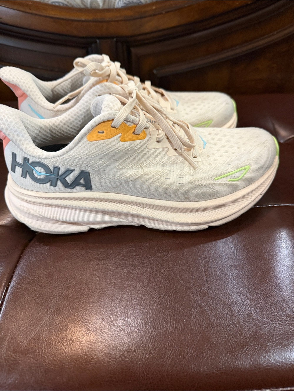 Hoka Cream Running Shoes with Blue, Yellow, Pink, and Green Accents